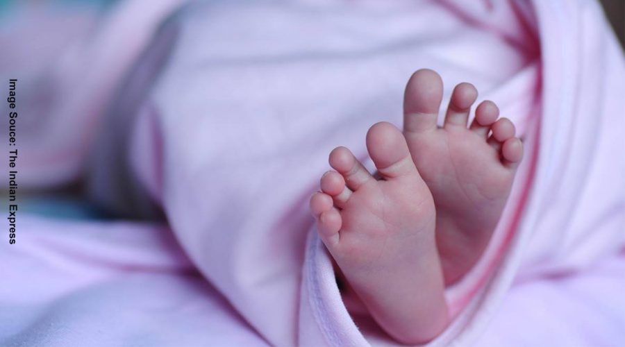 BABY FEET PEEPING FROM BLANKET